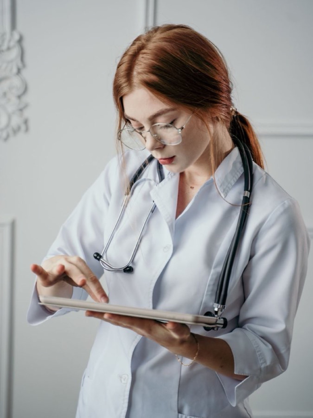 A dentist with a tablet